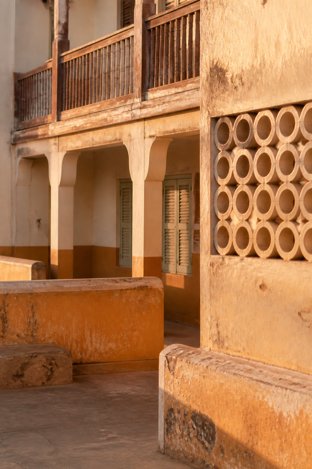 A sunlit Lagos courtyard and building facade