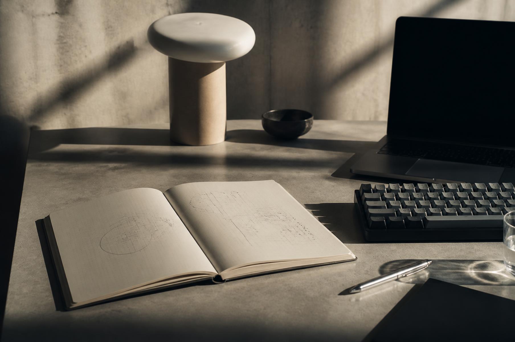 Notebook and tools on a thinking desk